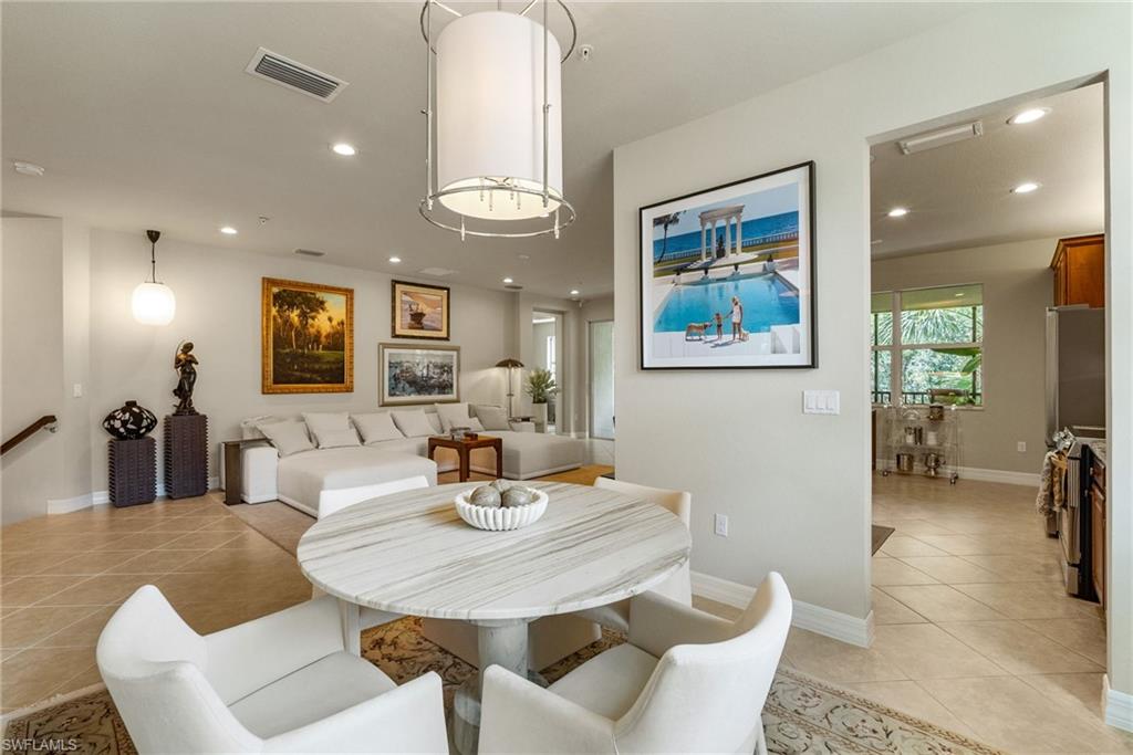 6510 Monterey Point, Unit 204 Naples, FL 34105 - Photo 11 of 48 a dining room with furniture and wooden floor