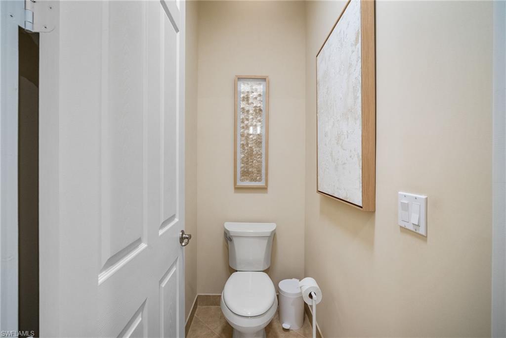 6510 Monterey Point, Unit 204 Naples, FL 34105 - Photo 20 of 48 a white toilet sitting next to a small bathroom