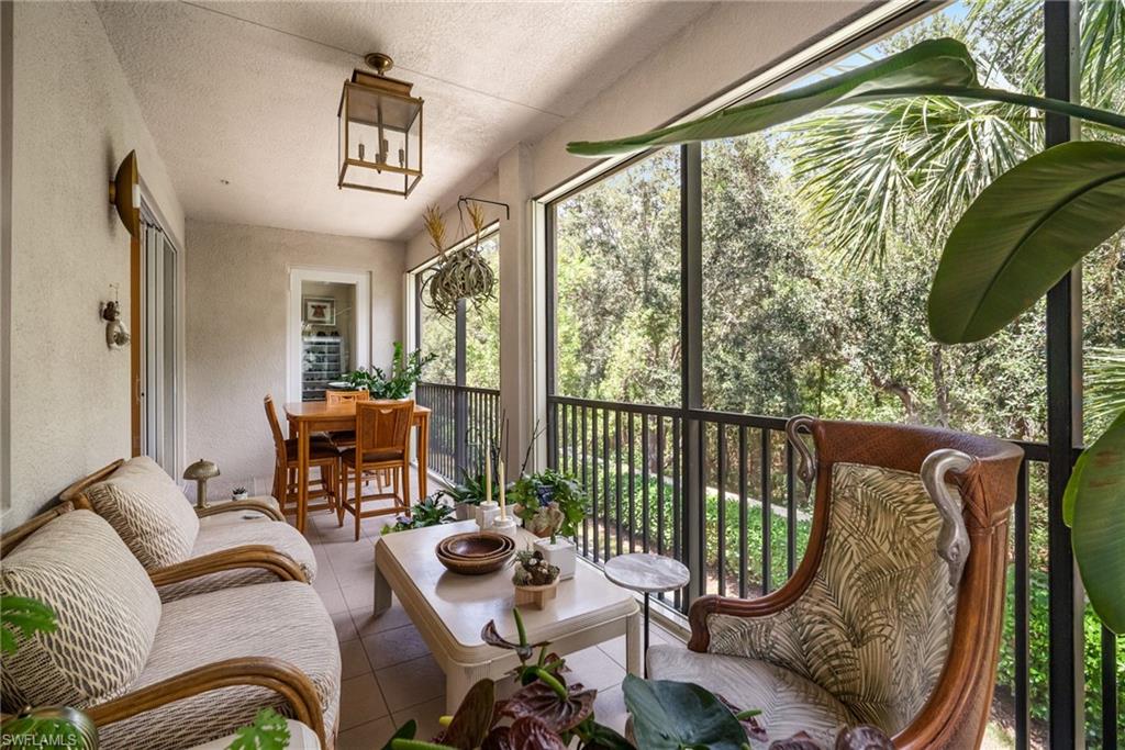 6510 Monterey Point, Unit 204 Naples, FL 34105 - Photo 24 of 48 a living room with furniture and a window
