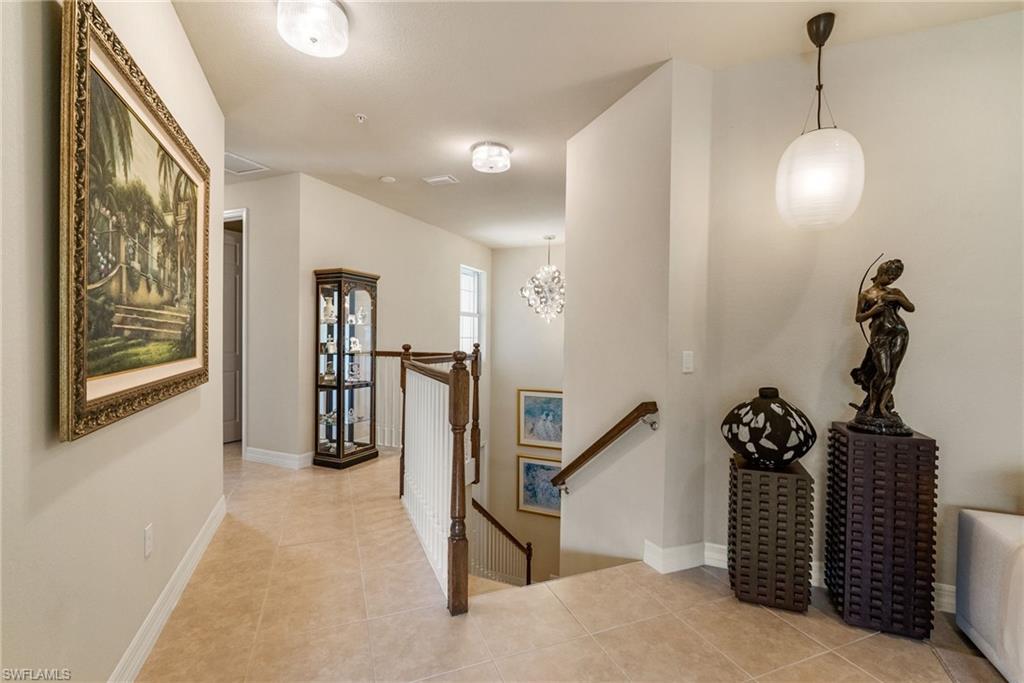 6510 Monterey Point, Unit 204 Naples, FL 34105 - Photo 35 of 48 a view of a hallway with stairs