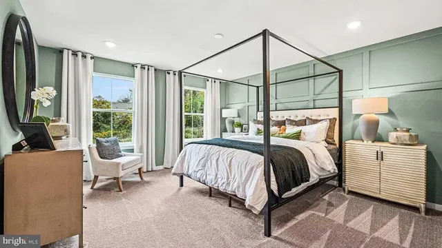 a bedroom with a large bed and a window