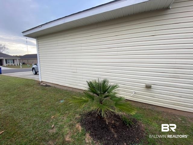 22713 Respite Lane Foley, AL 36535 - Photo 32 of 35 View of side of property featuring a yard