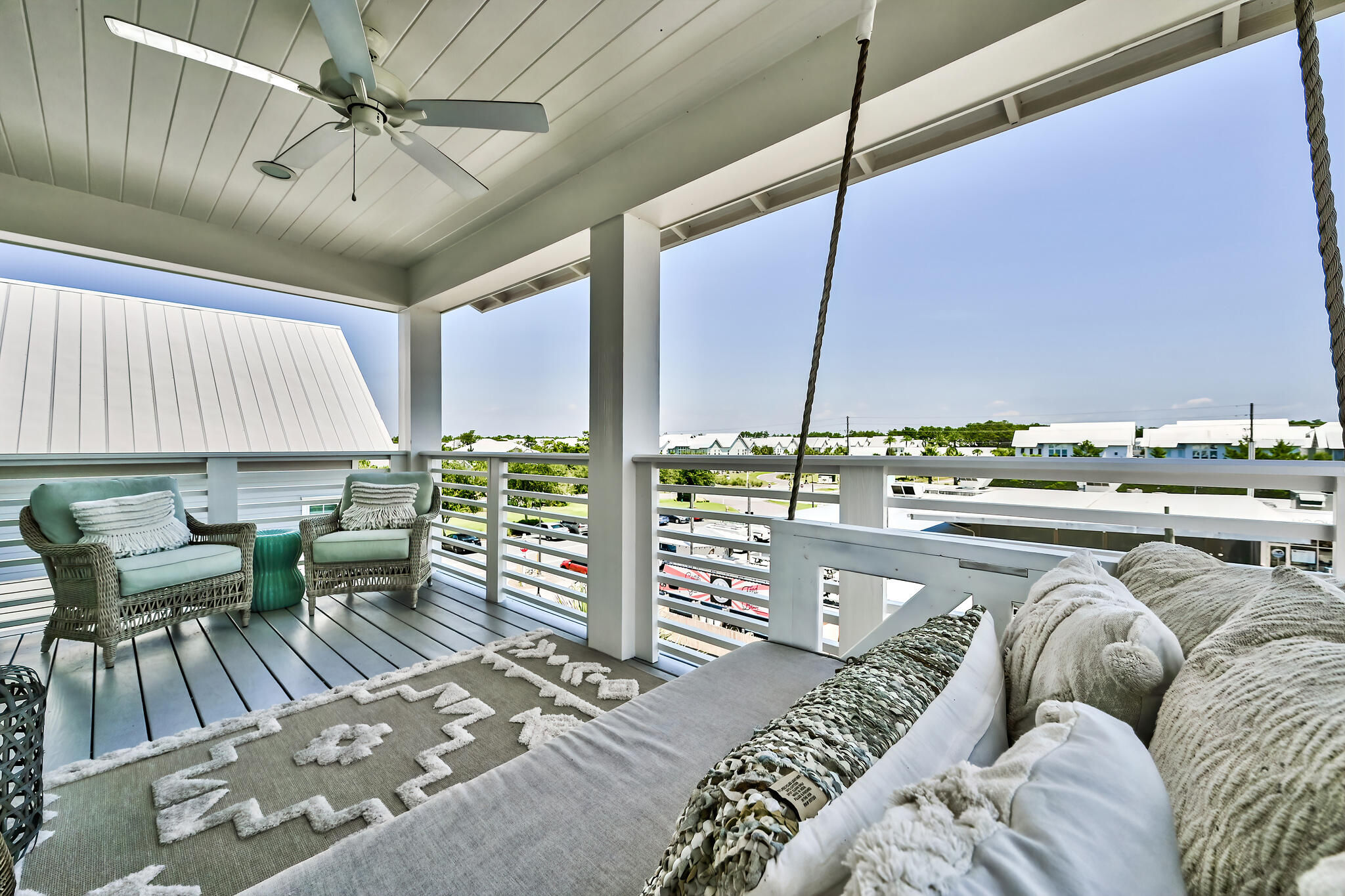 21 Pleasant St Inlet Beach Inlet Beach, FL 32461 - Photo 29 of 37 a living room with furniture a chandelier and a floor to ceiling window