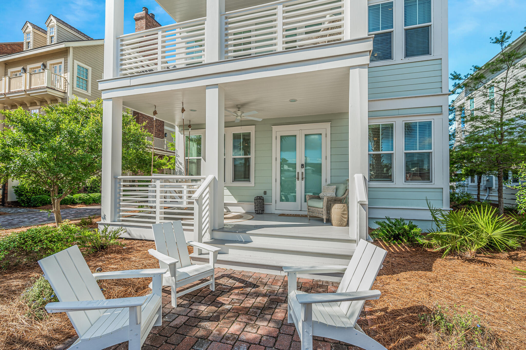21 Pleasant St Inlet Beach Inlet Beach, FL 32461 - Photo 32 of 37 front view of a house with a chairs and table in a patio