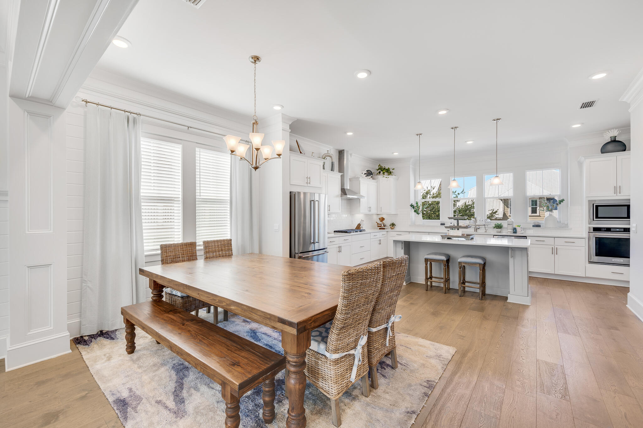 21 Pleasant St Inlet Beach Inlet Beach, FL 32461 - Photo 6 of 37 a dining room with stainless steel appliances kitchen island granite countertop a table chairs and a view of living room