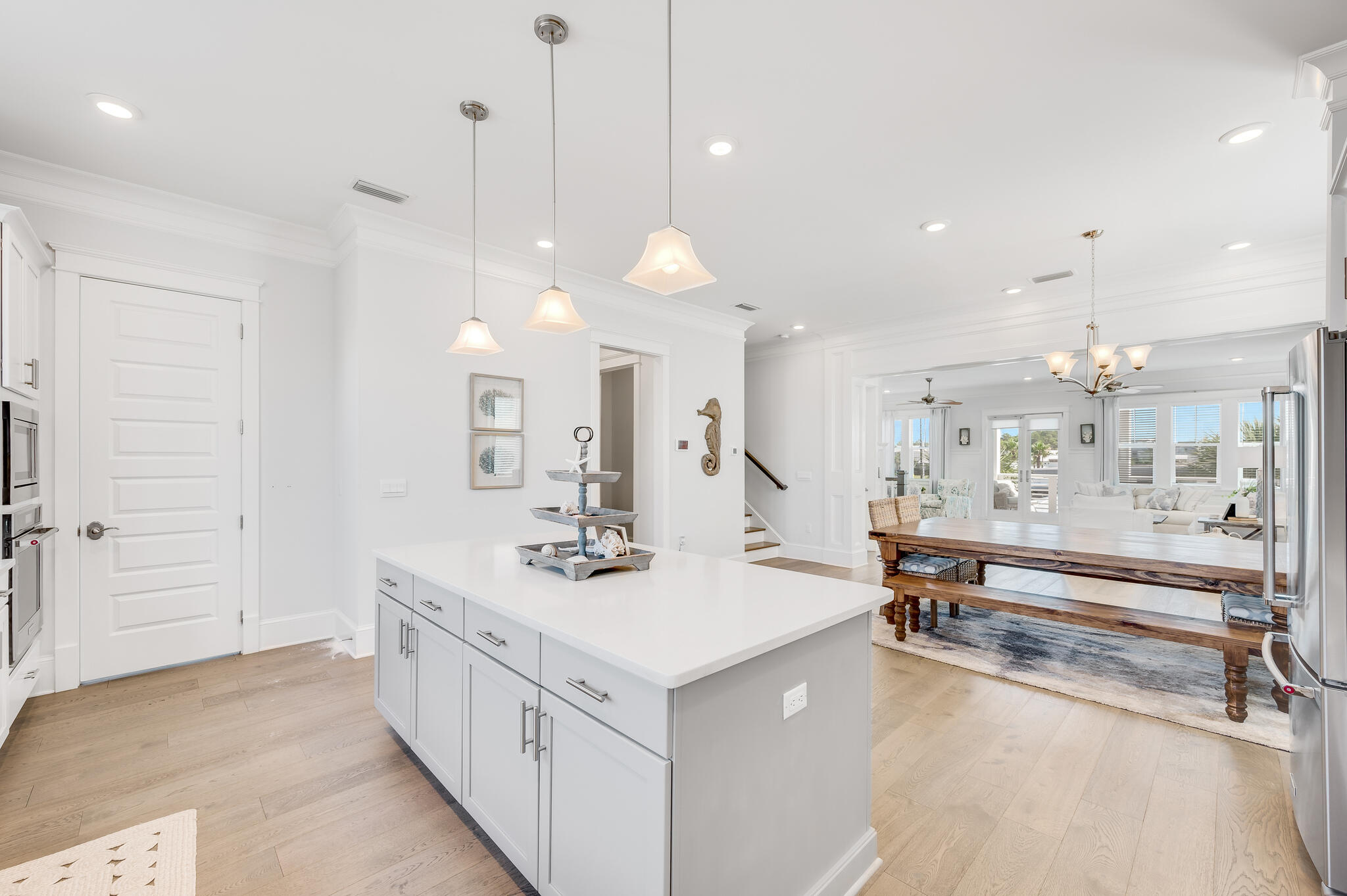 21 Pleasant St Inlet Beach Inlet Beach, FL 32461 - Photo 8 of 37 a large white kitchen with a large island oven a refrigerator and a sink