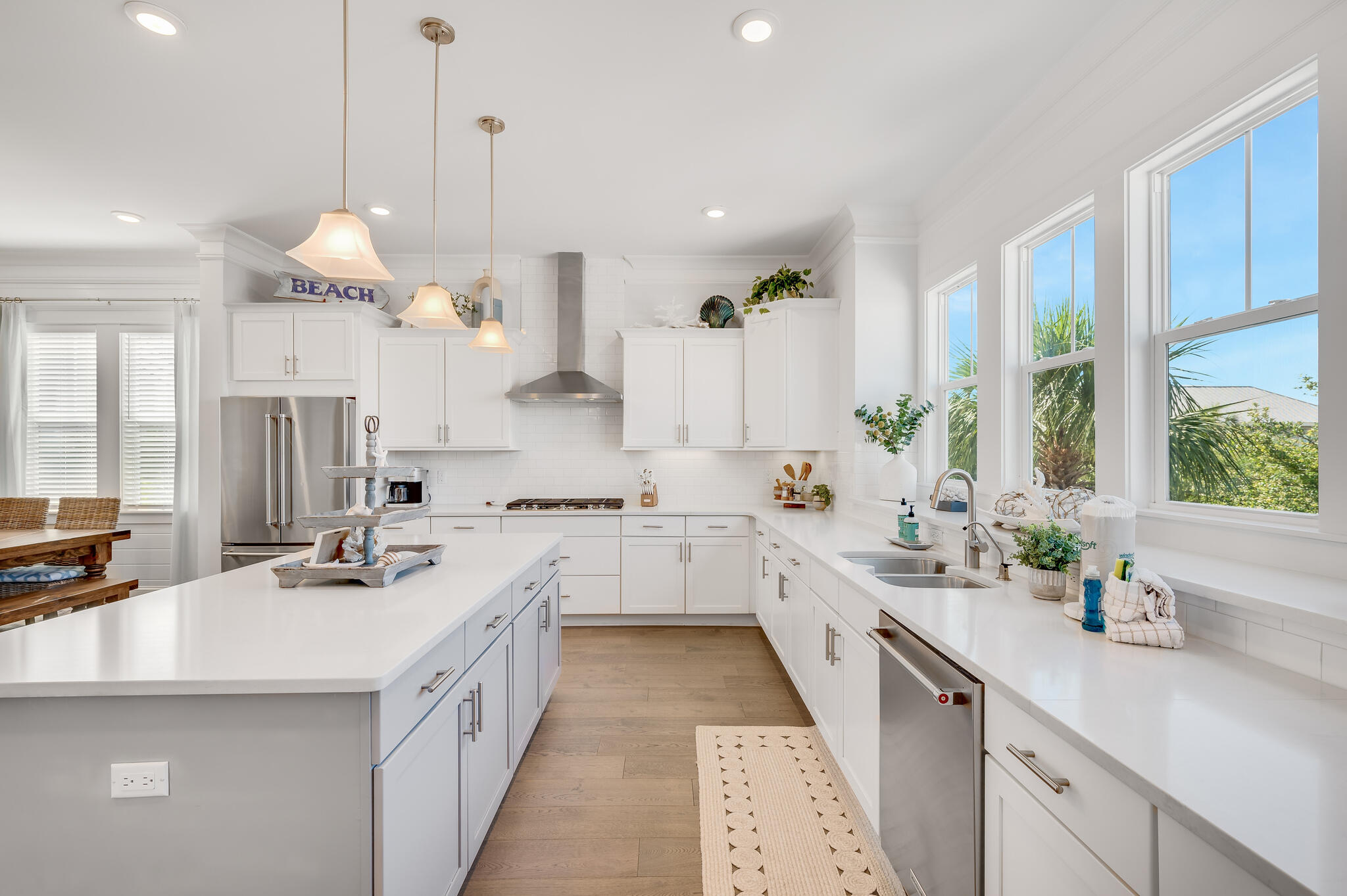 21 Pleasant St Inlet Beach Inlet Beach, FL 32461 - Photo 10 of 37 a large white kitchen with a sink and dishwasher with white cabinets