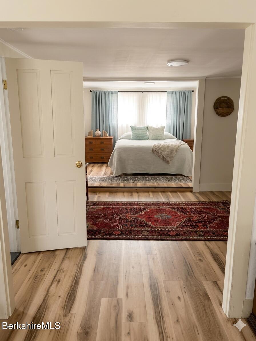 27 North Main Road Otis, MA 01253 - Photo 12 of 24 a bedroom with a bed and window