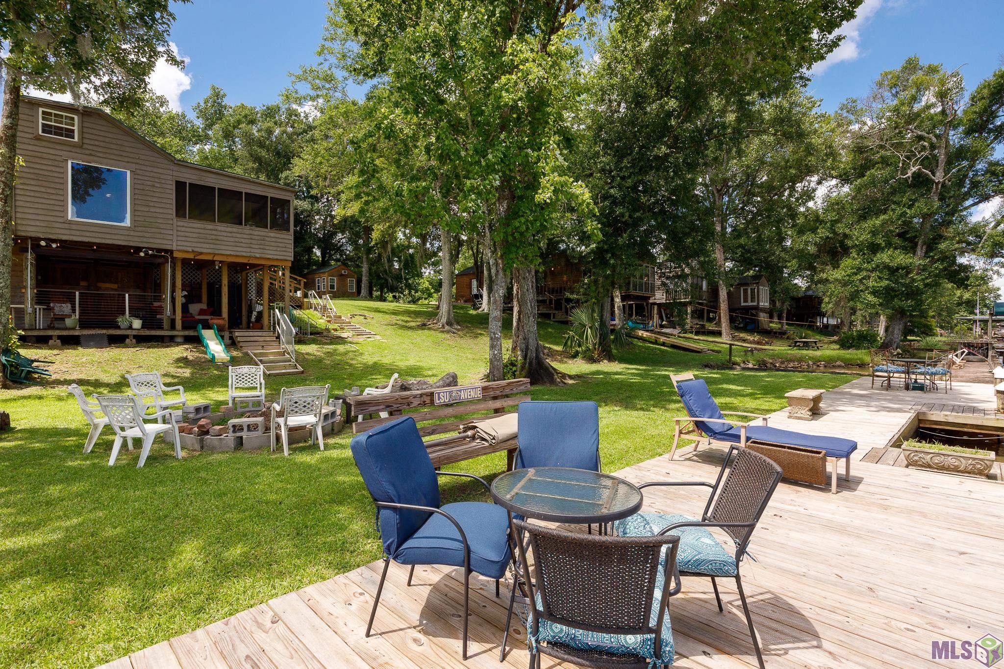 21054 Diversion Canal Road St. Amant, LA 70774 - Photo 1 of 48 Deck perfect for tanning!