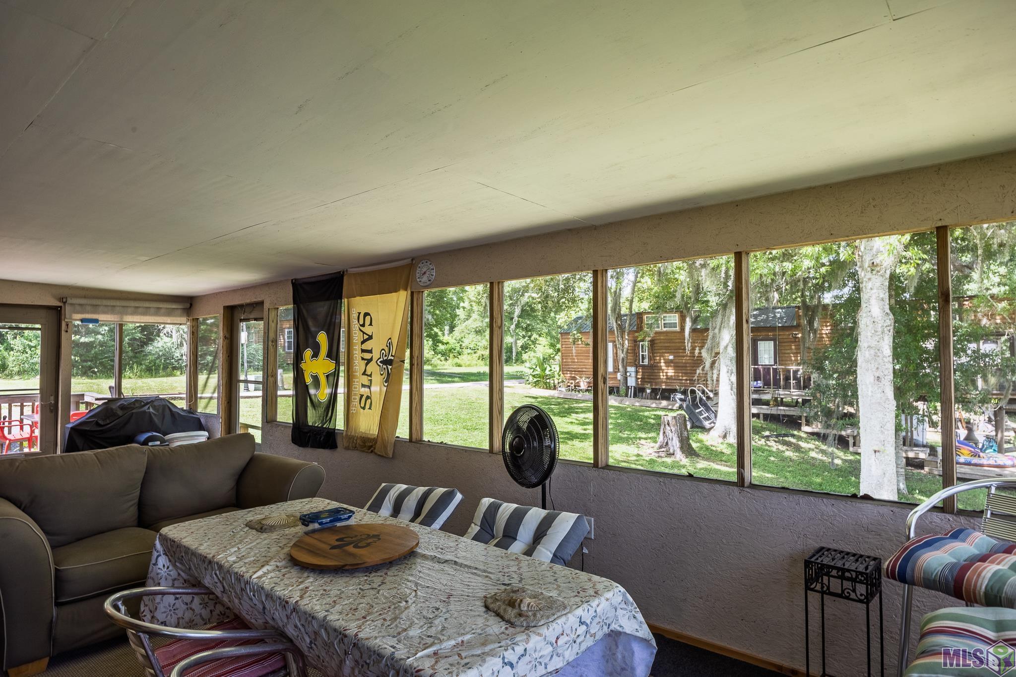 21054 Diversion Canal Road St. Amant, LA 70774 - Photo 23 of 48 Enclosed Side Porch