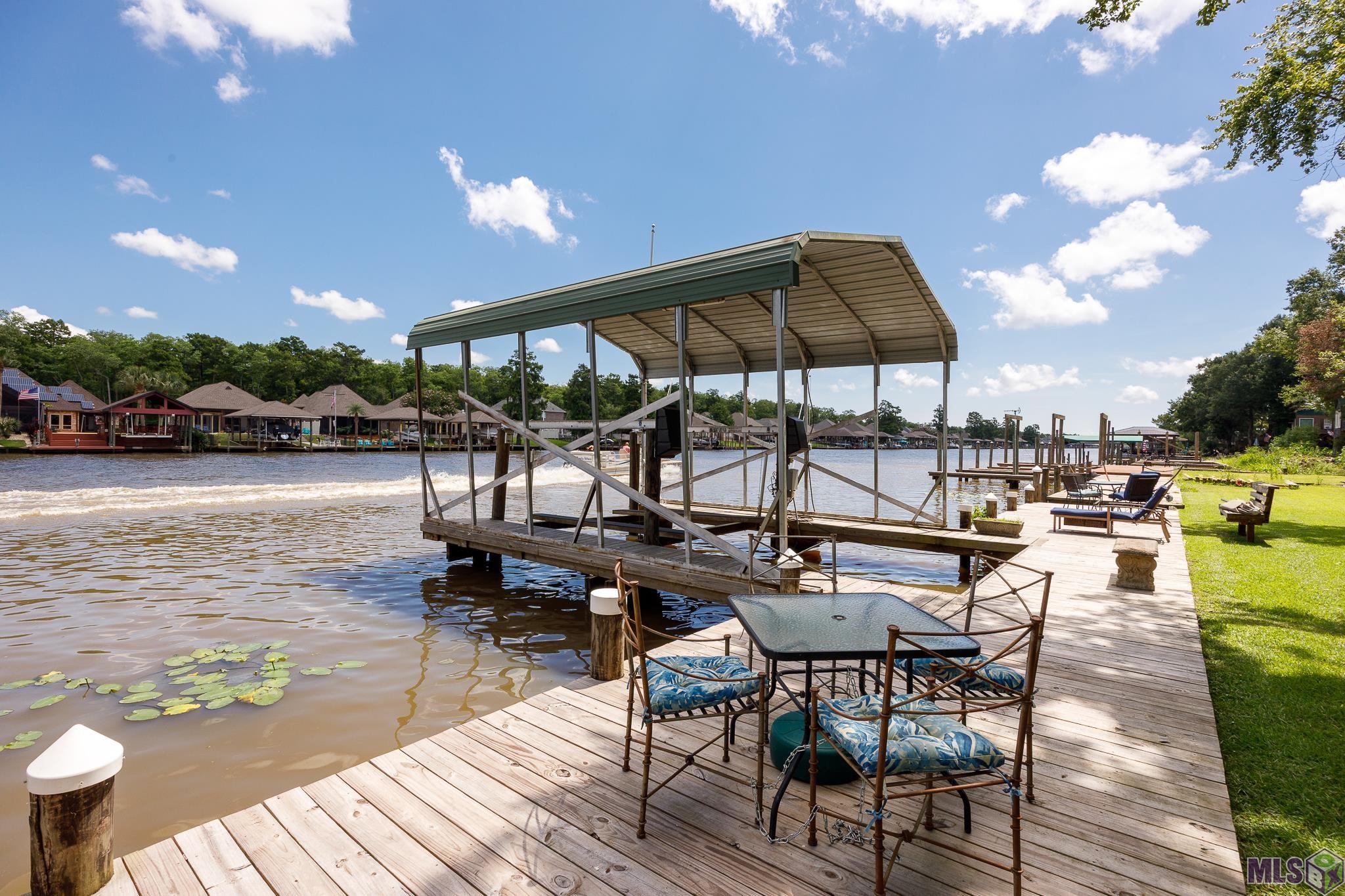 21054 Diversion Canal Road St. Amant, LA 70774 - Photo 32 of 48 Covered Boat Lift & Deck