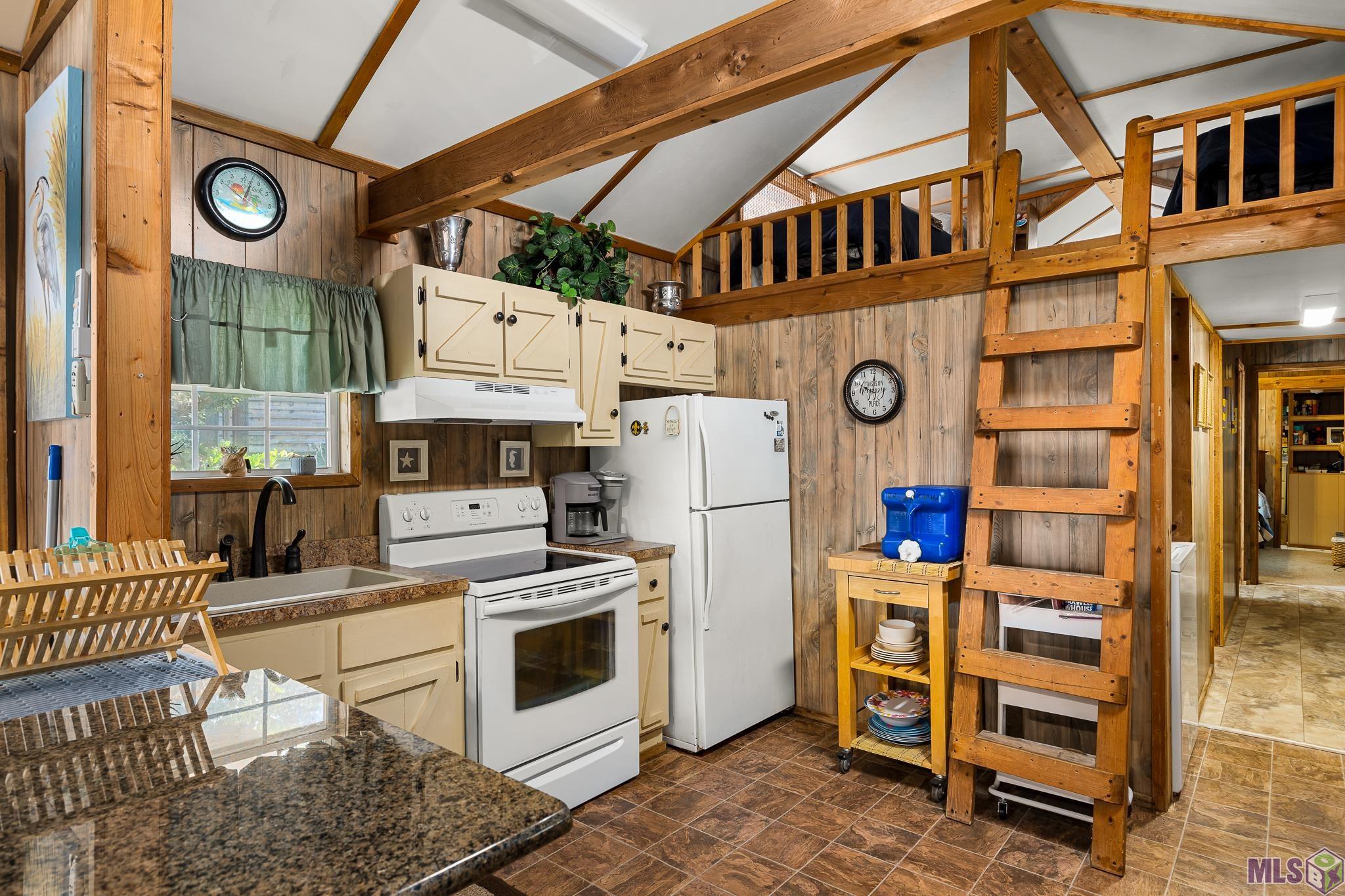 21054 Diversion Canal Road St. Amant, LA 70774 - Photo 9 of 48 Kitchen with Upstairs Loft