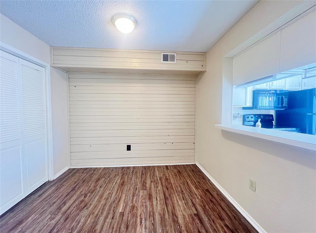 5626 Preston Oaks Road, Unit 43D Dallas, TX 75254 - Photo 4 of 9 a view of a room with wooden floors and led lights