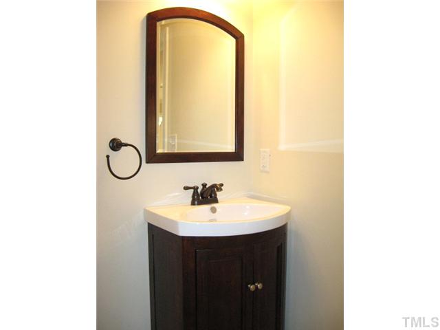 5596 Brogden Road Smithfield, NC 27577 - Photo 11 of 12 First floor powder room with tile floor