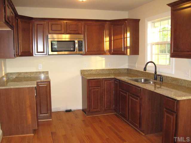5596 Brogden Road Smithfield, NC 27577 - Photo 2 of 12 Beautiful kitchen with granite counters, stainless steel appliances, & new cabinets