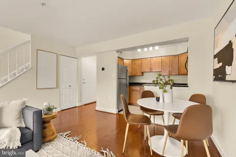 a view of kitchen with cabinets and wooden floor