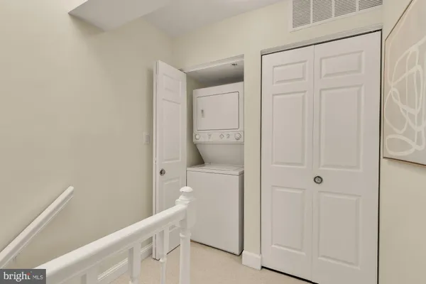a bathroom with a granite countertop sink a toilet a mirror and shower