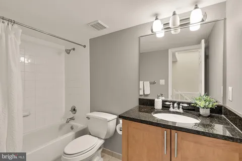 a bathroom with a shower curtain and a bathtub