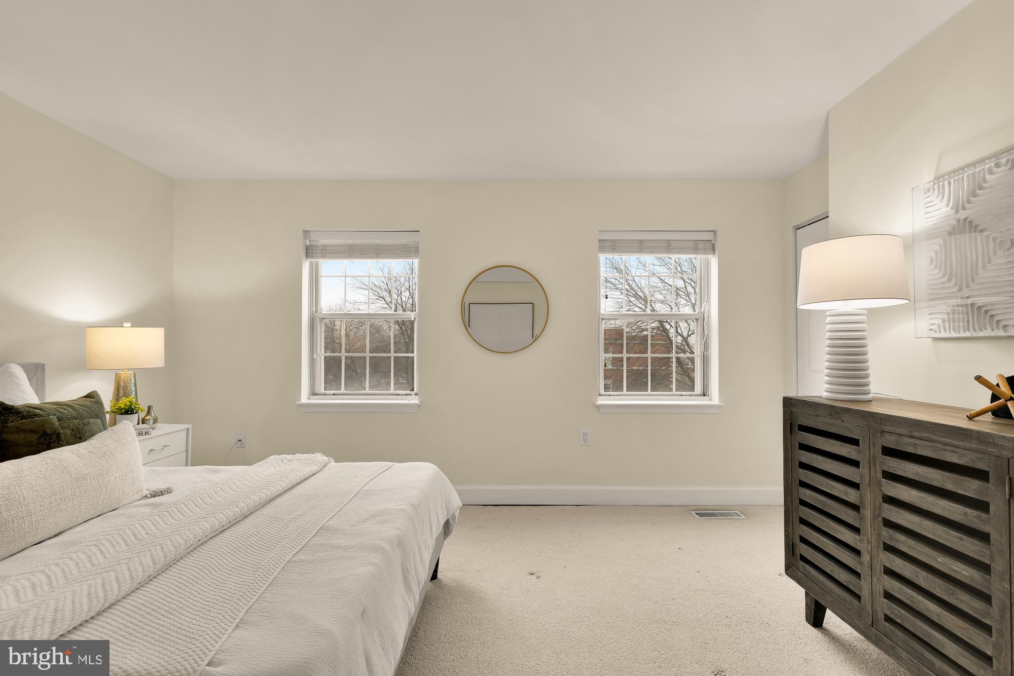 3804 Rodman Street Northwest, Unit 303 Washington, DC 20016 - Photo 26 of 33 a bedroom with a bed and a window