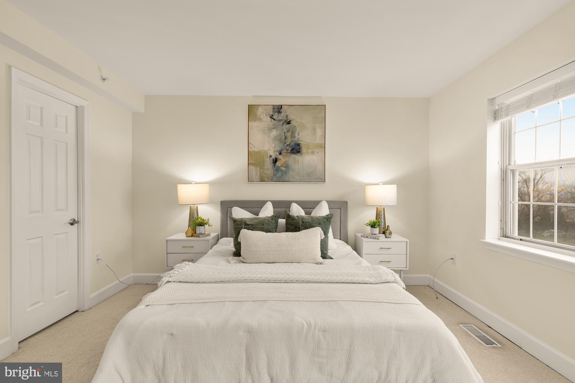 3804 Rodman Street Northwest, Unit 303 Washington, DC 20016 - Photo 27 of 32 a bedroom with a bed and a window