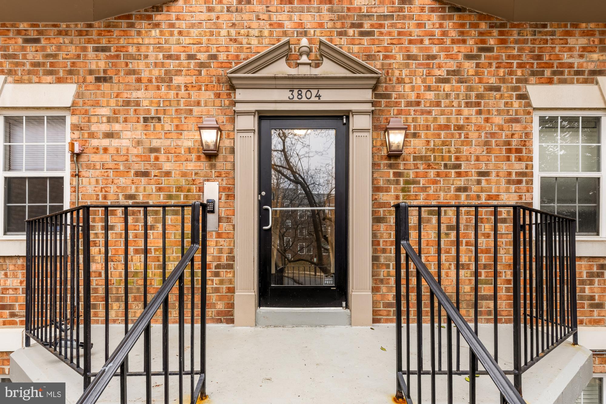 3804 Rodman Street Northwest, Unit 303 Washington, DC 20016 - Photo 3 of 32 a front view of a house with a door