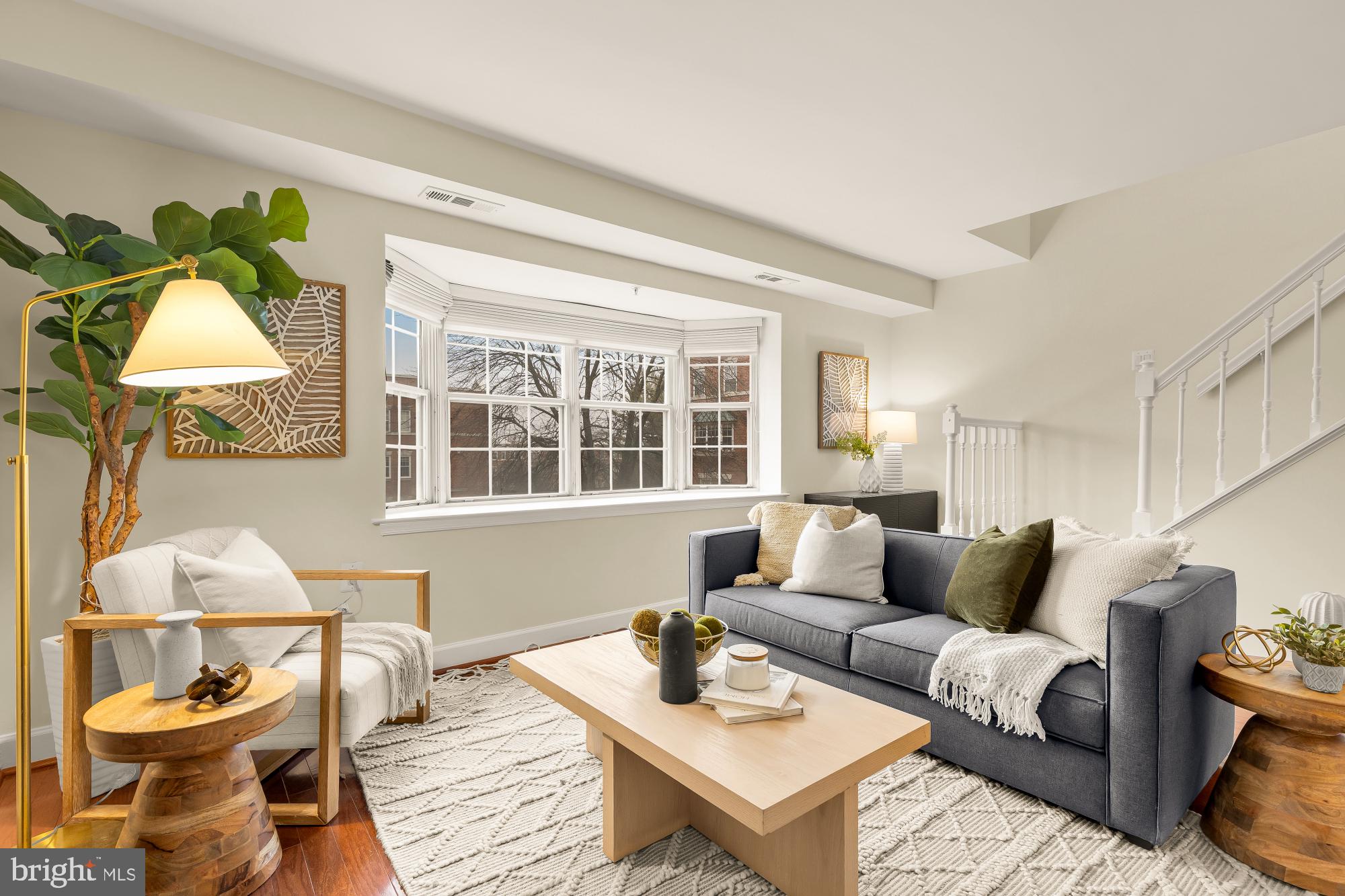3804 Rodman Street Northwest, Unit 303 Washington, DC 20016 - Photo 10 of 32 a living room with furniture and a window
