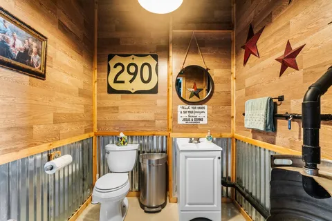 a bathroom with a toilet and a sink