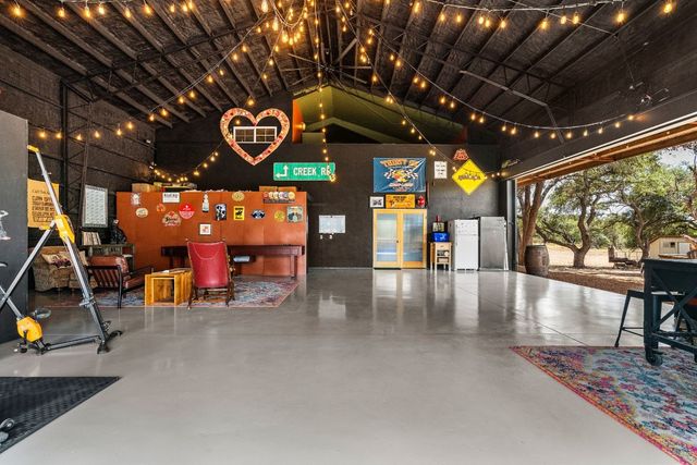 a view of a studio with wooden floor