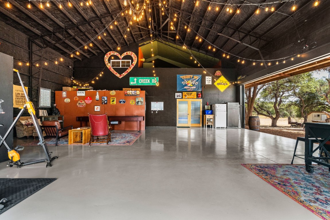 7394 Creek Road Dripping Springs, TX 78620 - Photo 2 of 39 a view of a studio with wooden floor