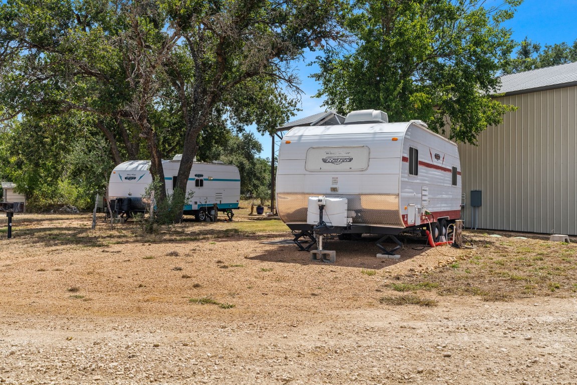 7394 Creek Road Dripping Springs, TX 78620 - Photo 34 of 39 a view of a house with a yard covered in snow