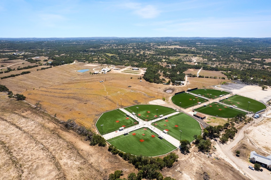7394 Creek Road Dripping Springs, TX 78620 - Photo 36 of 39 an aerial view of residential houses with outdoor space