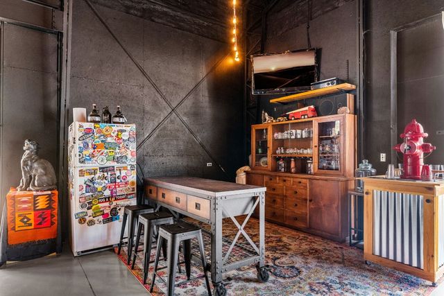 a room with chairs and cabinets