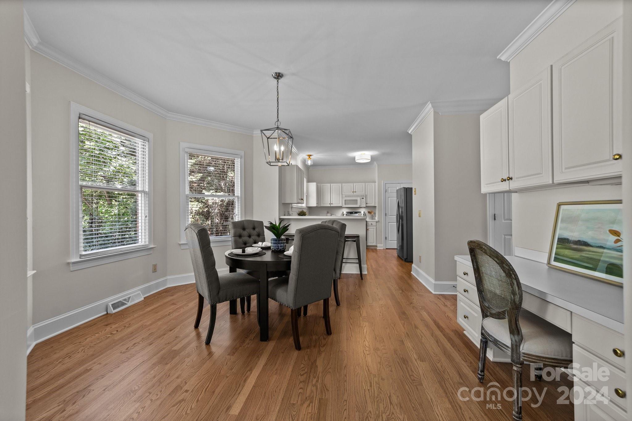 101 North Kimberly Road Davidson, NC 28036 - Photo 14 of 38 a view of a dining room with furniture window and wooden floor