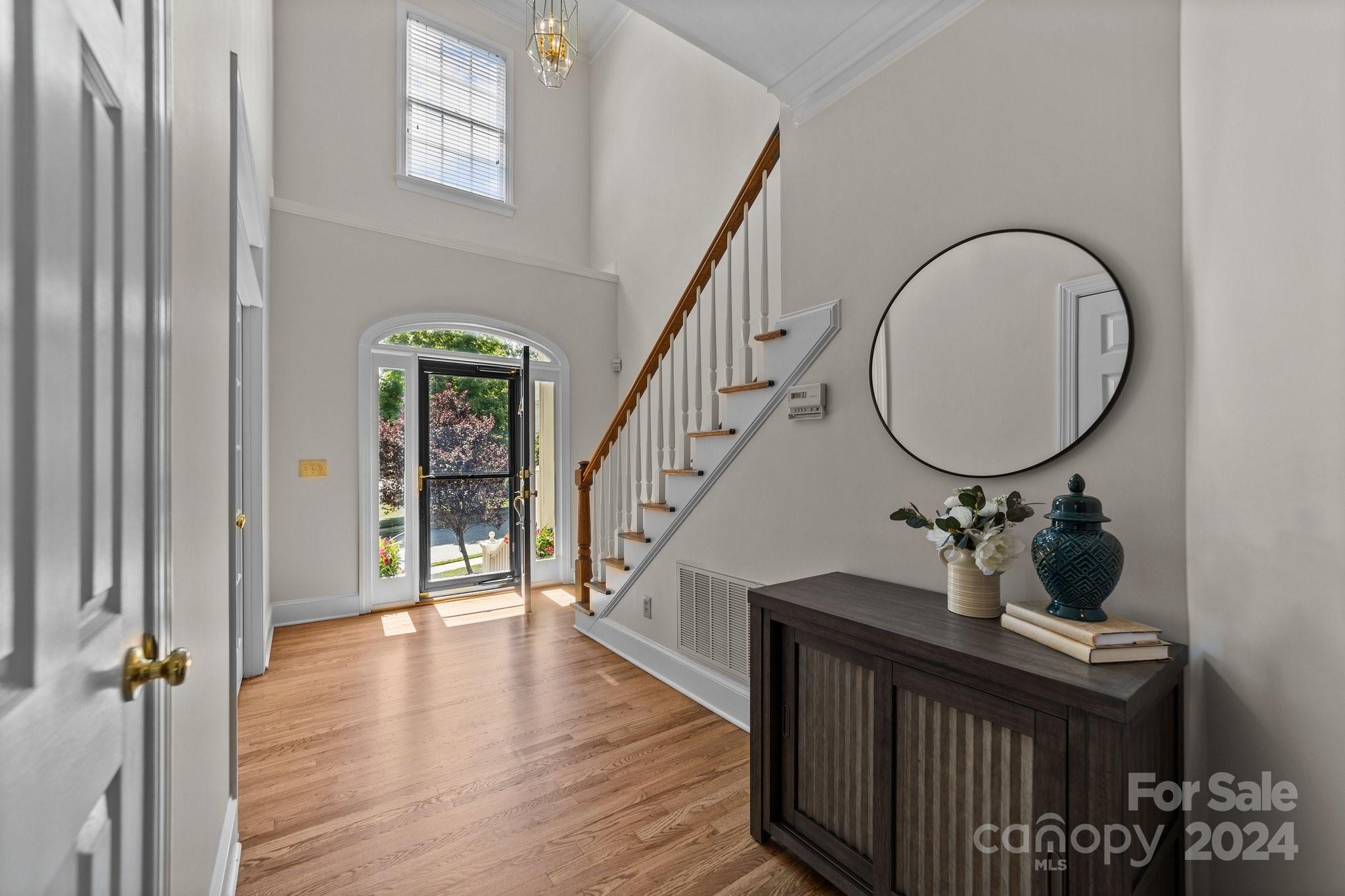 101 North Kimberly Road Davidson, NC 28036 - Photo 6 of 38 a view of a hallway with wooden floor and staircase
