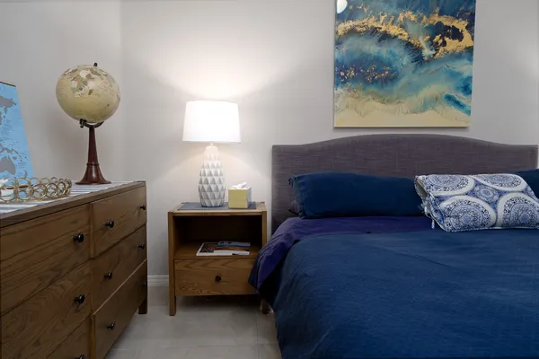 a bedroom with a bed and window