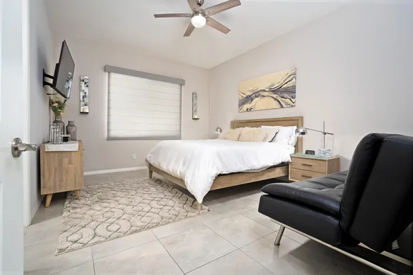 a bedroom with a bed and furniture