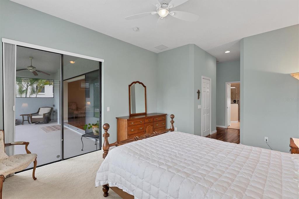 7909 Rio Bella Place Bradenton, FL 34201 - Photo 12 of 34 a bedroom with a bed and a mirror