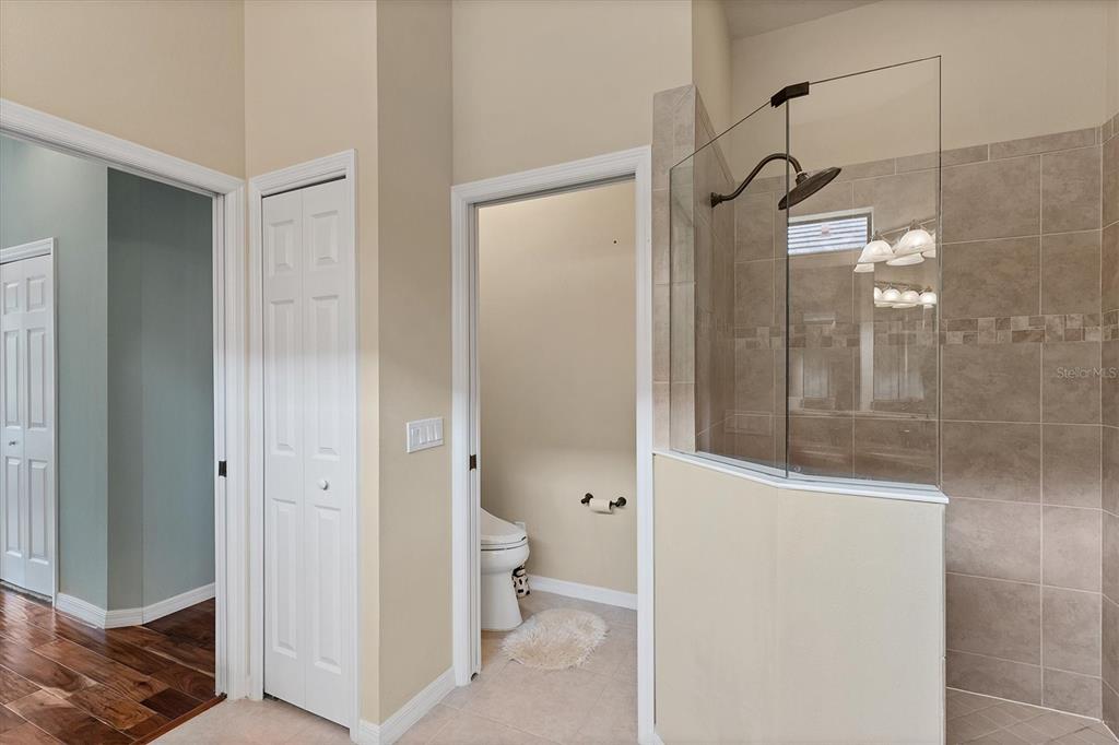 7909 Rio Bella Place Bradenton, FL 34201 - Photo 14 of 38 a bathroom with a shower and a toilet