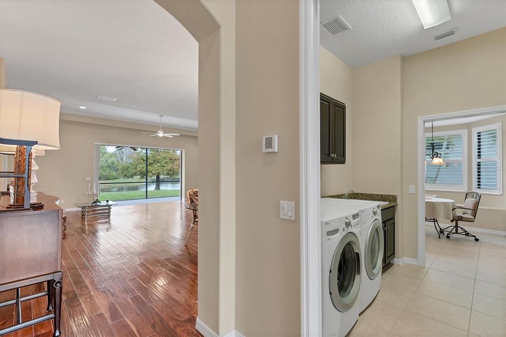 7909 Rio Bella Place Bradenton, FL 34201 - Photo 18 of 34 a view of a kitchen and washer and dryer