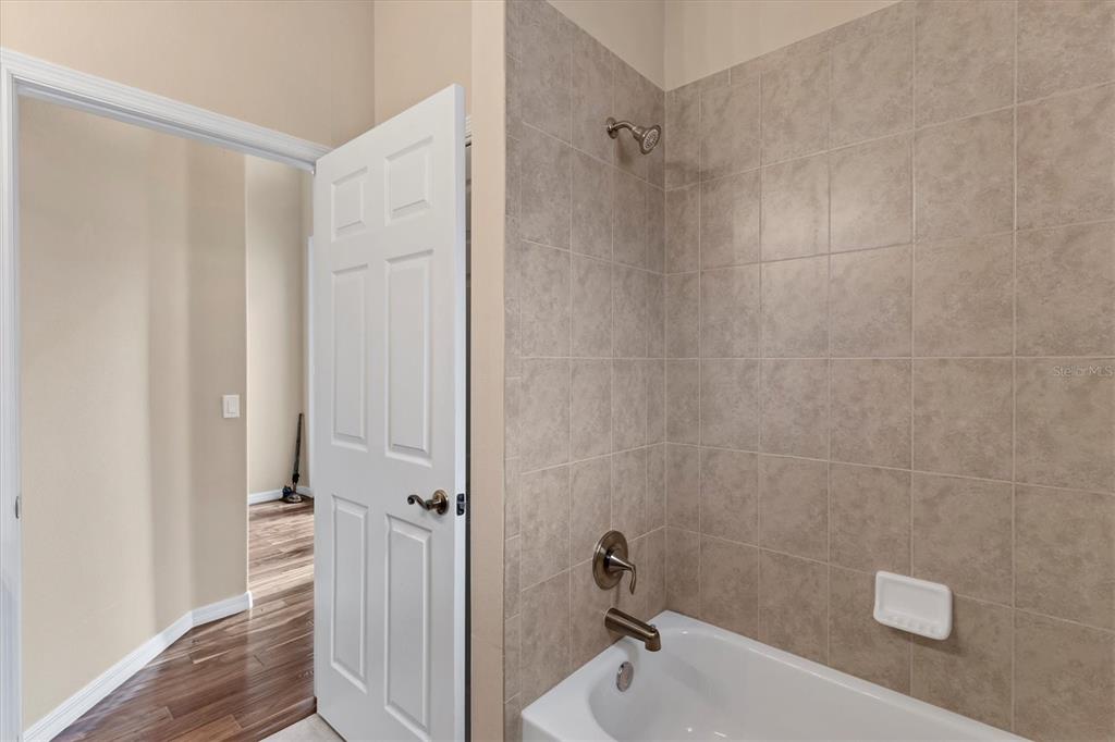 7909 Rio Bella Place Bradenton, FL 34201 - Photo 18 of 38 a bathroom with a sink and a tub