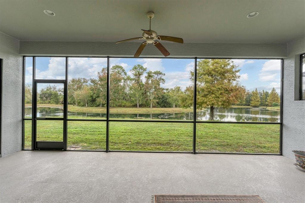 7909 Rio Bella Place Bradenton, FL 34201 - Photo 21 of 34 a view of a big room with an outdoor view and a floor to ceiling window