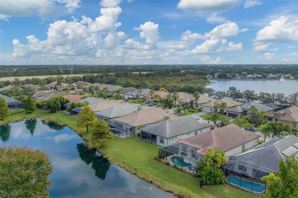 7909 Rio Bella Place Bradenton, FL 34201 - Photo 25 of 34 an aerial view of a house with a lake view
