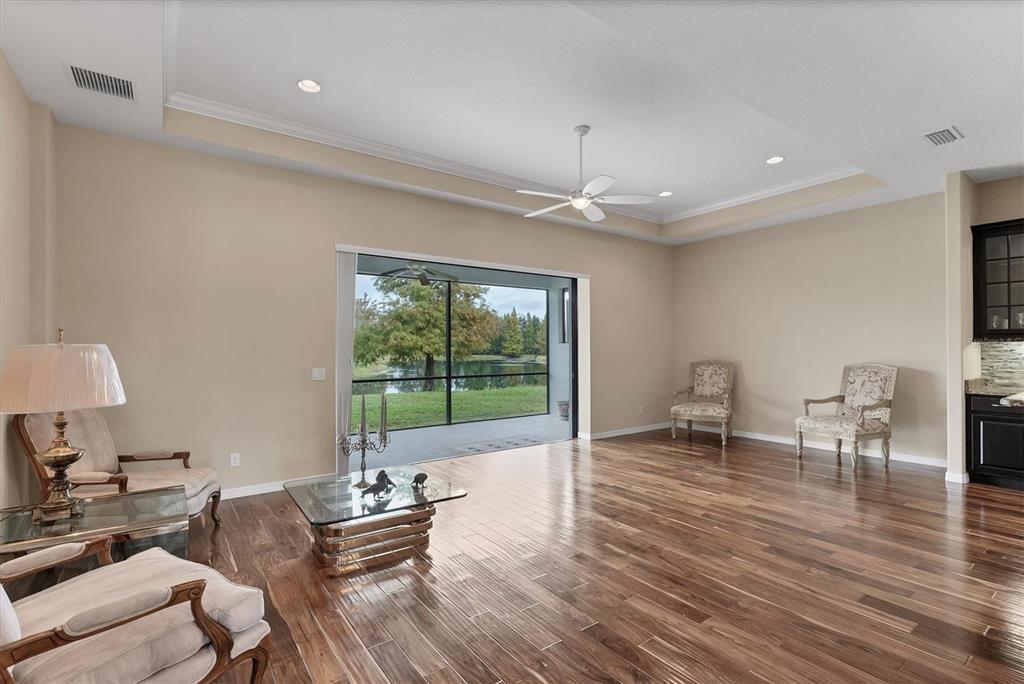 7909 Rio Bella Place Bradenton, FL 34201 - Photo 6 of 38 a living room with furniture and a large window