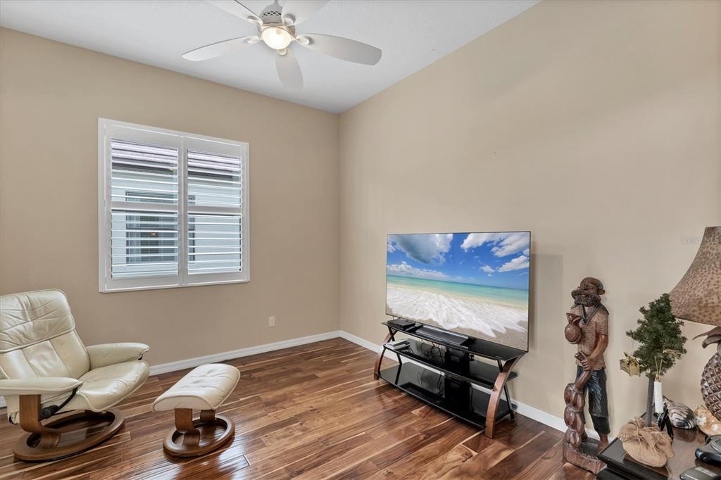 7909 Rio Bella Place Bradenton, FL 34201 - Photo 10 of 34 a living room with furniture and a flat screen tv