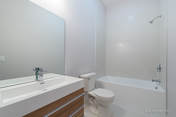 2835 West Division Street, Unit 4E Chicago, IL 60622 - Photo 12 of 25 a bathroom with a sink a toilet and shower