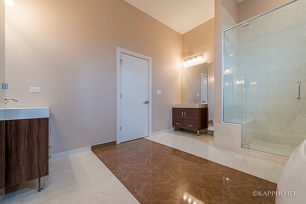 2835 West Division Street, Unit 4E Chicago, IL 60622 - Photo 14 of 25 a view of a hallway with wooden floor and a bathroom