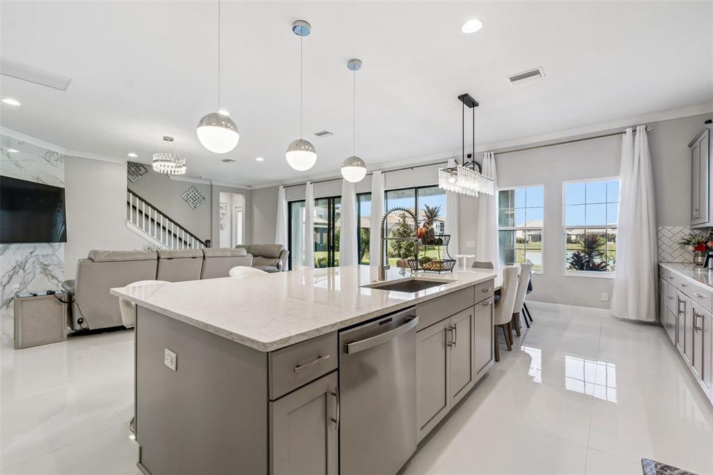 10863 Rustic Timber Loop San Antonio, FL 33576 - Photo 12 of 56 a kitchen with a sink a counter top space and stainless steel appliances