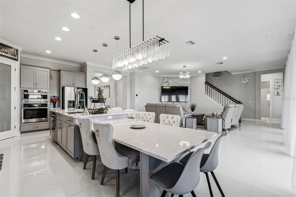 10863 Rustic Timber Loop San Antonio, FL 33576 - Photo 14 of 56 a large kitchen with a table and chairs