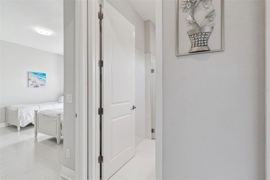 10863 Rustic Timber Loop San Antonio, FL 33576 - Photo 19 of 56 a view of a bathroom with a toilet and a bathroom