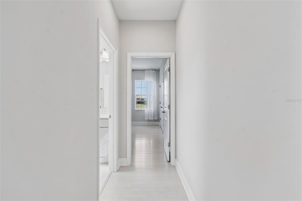 10863 Rustic Timber Loop San Antonio, FL 33576 - Photo 27 of 56 a view of a bathroom from a hallway